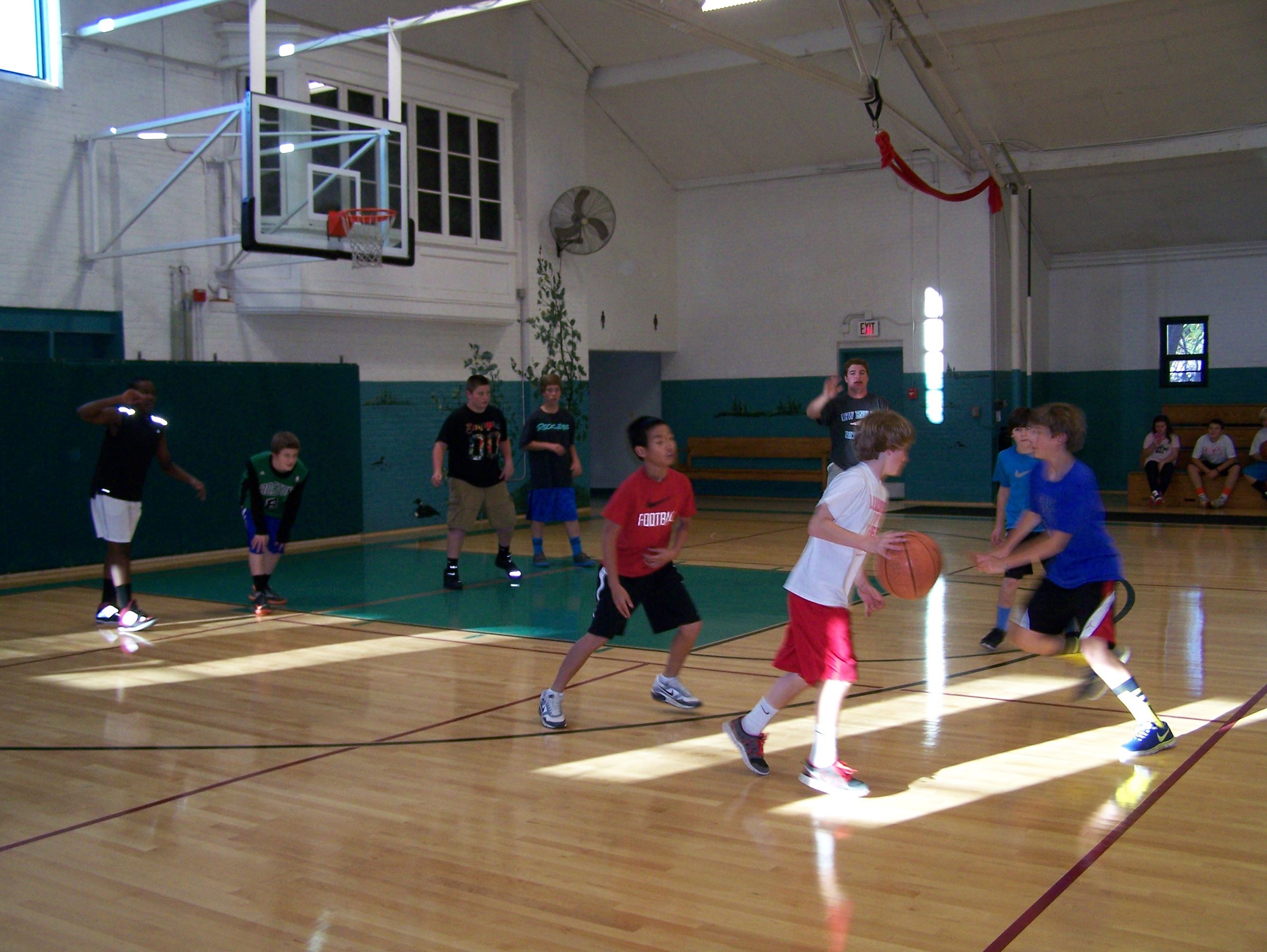 A photo of Middle School Students playing basketball